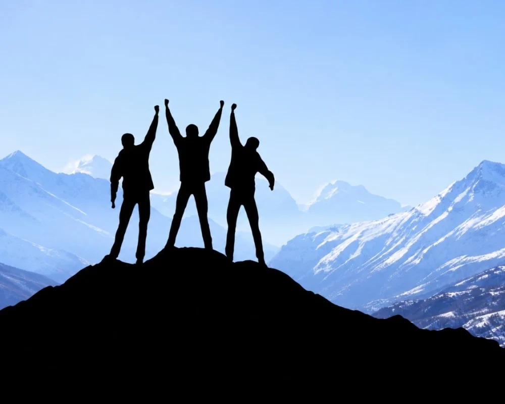 Triumphant Hikers Above Snowy Peaks-150kb